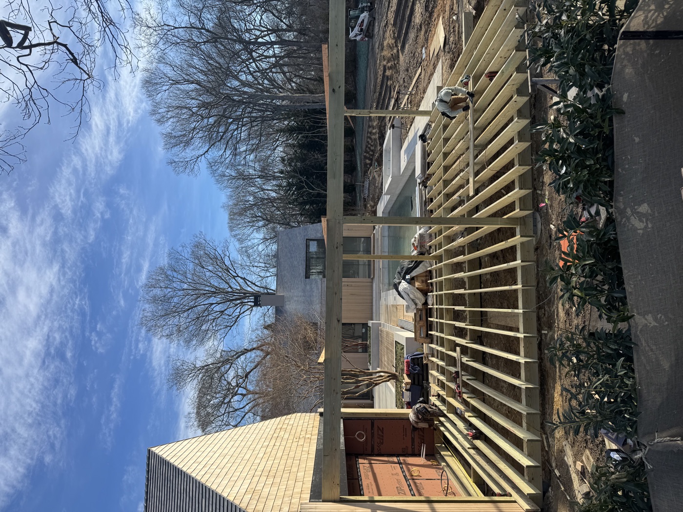 Deck structure framed with the home and pool beyond