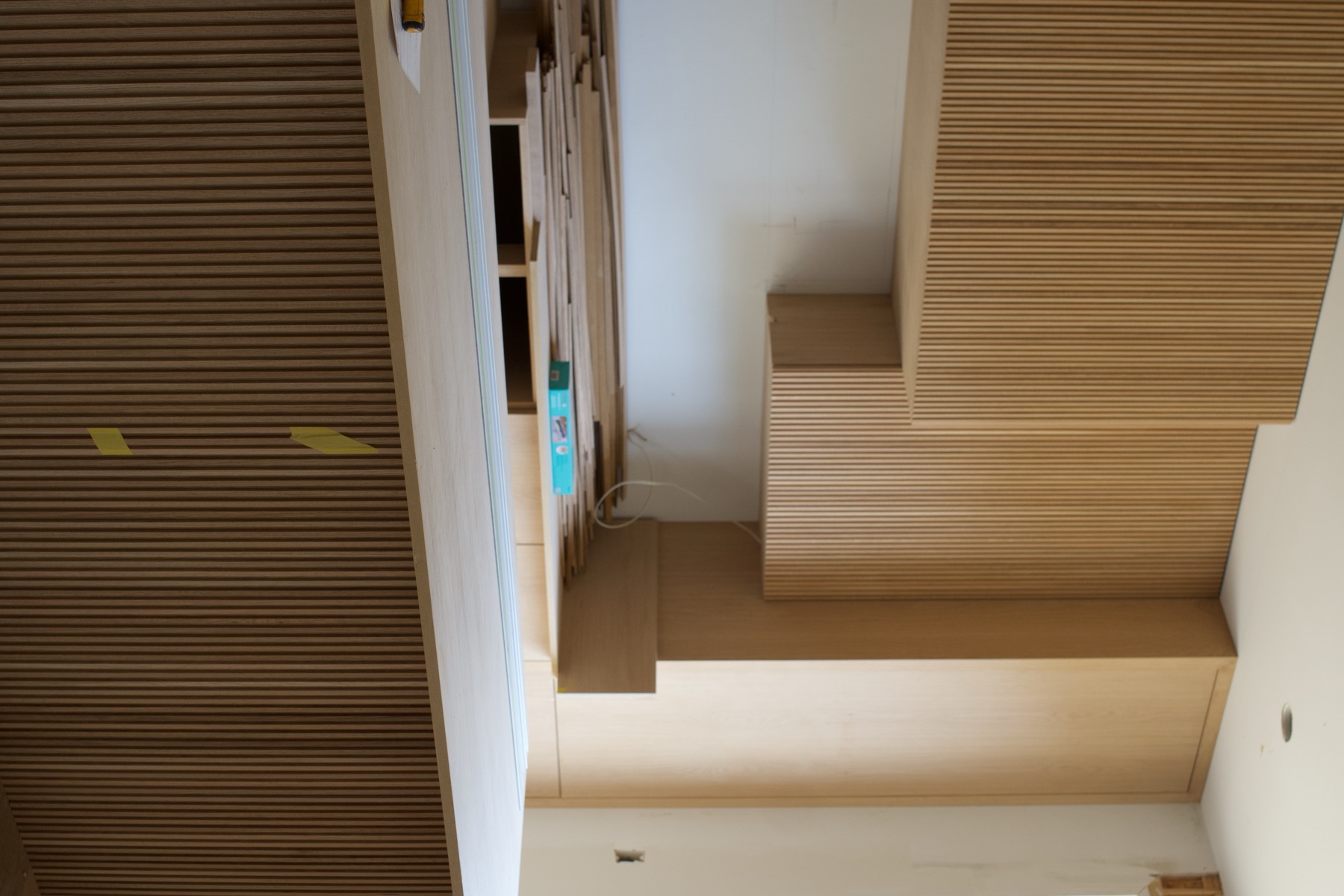 Reeded white oak kitchen cabinetry and island
