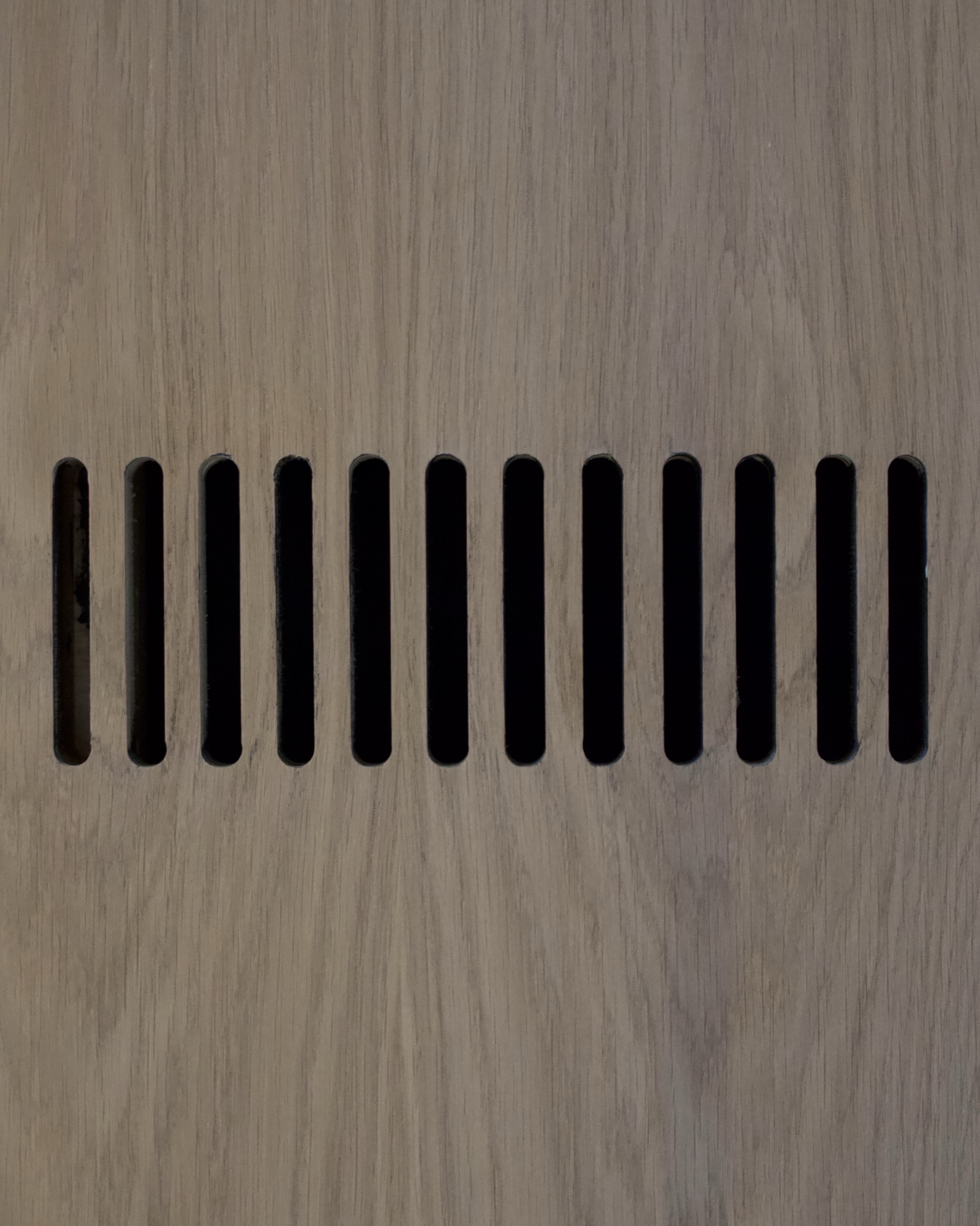 Hand-carved white oak ventilation grille detail