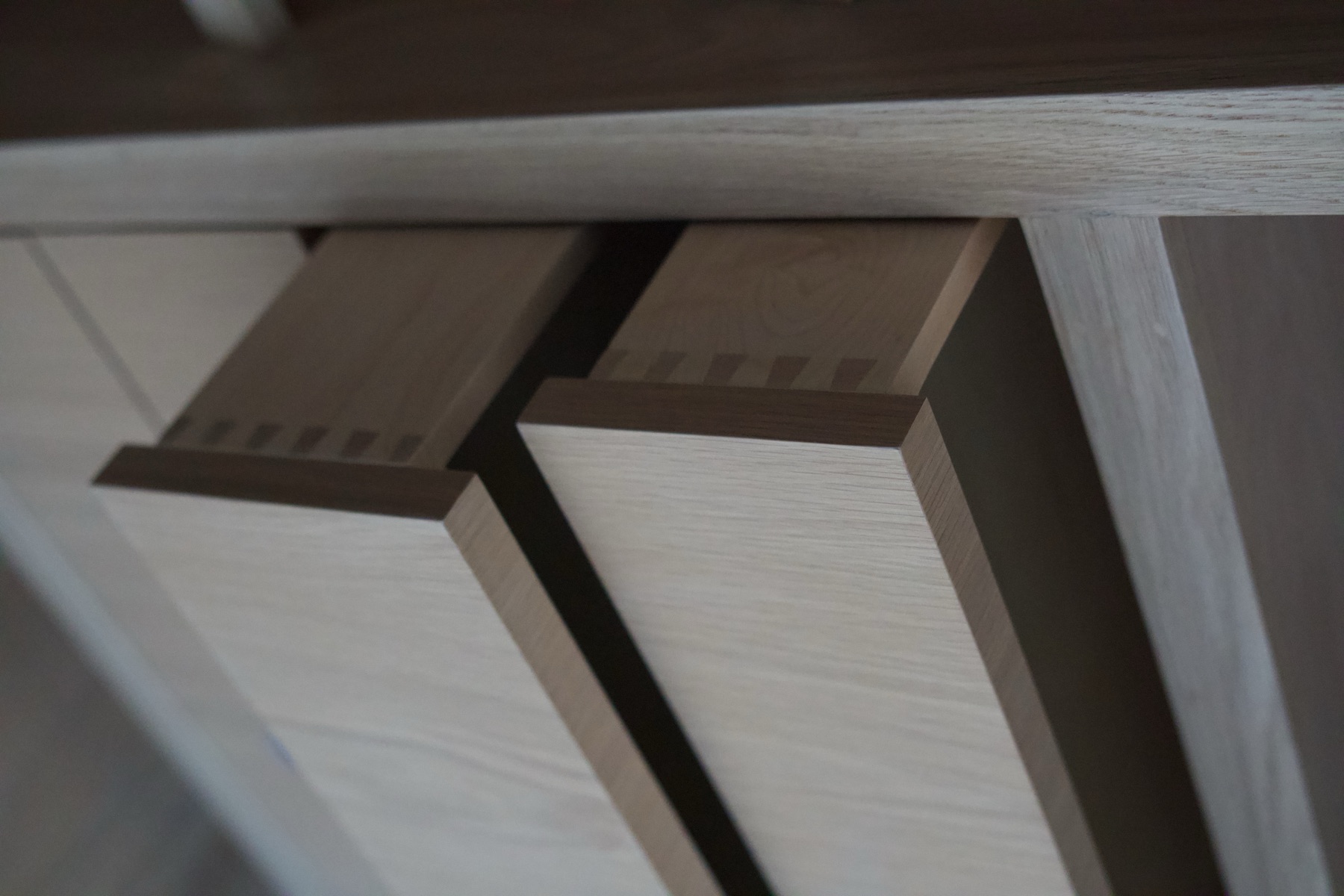 Hand-cut dovetail joinery on white oak drawers